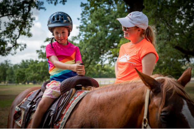a little girl getting ready to go horseback riding in College Station, Texas